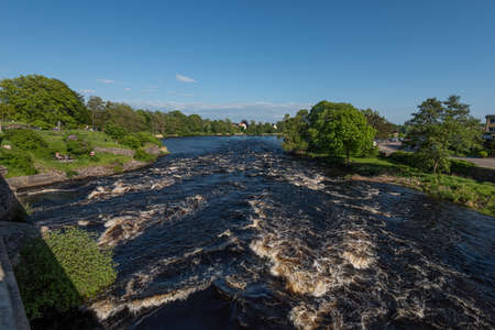 Looking out over rapids of Ã„ttran under tullbron.