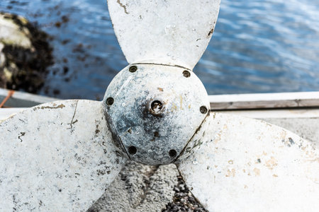 Old and corroded metal propeller of a fishing boatの写真素材