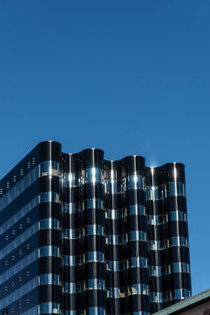 Wavy formed glass facade of a newly constructed office skyrise.