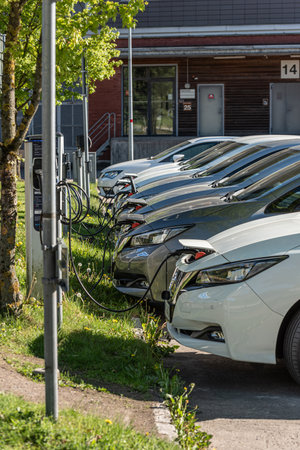 Gothenburg, Sweden - May 15 2022: Long row of Nissan Leaf electric cars chargingのeditorial素材