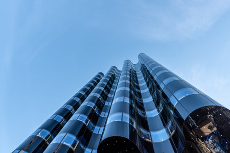 Gothenburg, Sweden - May 01 2022: Wavy glass facade of an office building under constructionのeditorial素材