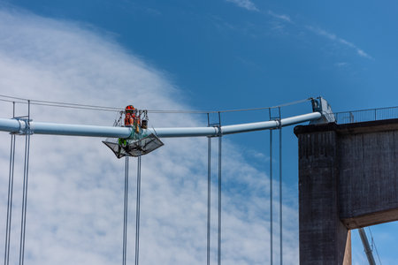 Gothenburg, Sweden - May 29 2022: Suspender cable bands of ?lvsborgsbron under maintenance.のeditorial素材