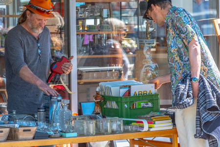 Gothenburg, Sweden - May 29 2022: People hunting for treasures at a street flea market Megaloppis in Majorna.