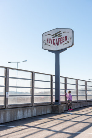 TÃ¸nsberg, Norway - April 15 2022: Flykafeen sign on the top of a pylon by the side of a road.のeditorial素材