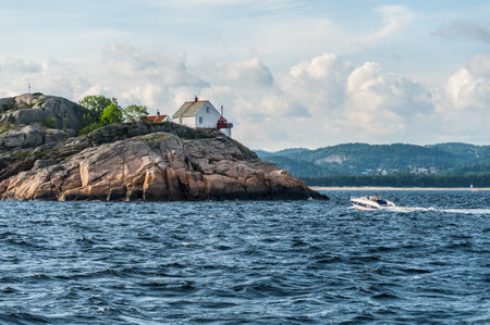 Lindesnes, Norway - July 06 2011: Hatholmen lighthouse outside Mandal.のeditorial素材