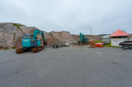 Lindesnes, Norway - July 05 2011: Two Kobelco diggers at a parking lot near Lindesnes Fyr.のeditorial素材