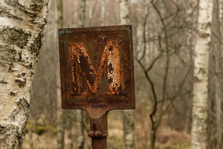 Old and rusty meeting point road sign.の写真素材