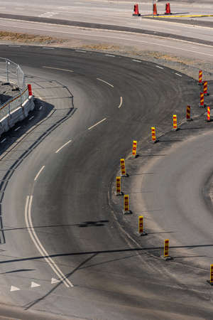 Curvy road by a construction zone.の写真素材