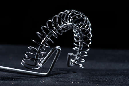 Metal whisk on black background.の写真素材