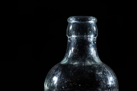 Top of a glass bottle on black background.の写真素材