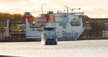 Gothenburg, Sweden - October 17 2021: Electric passenger ferry Elvy crossing the river.のeditorial素材