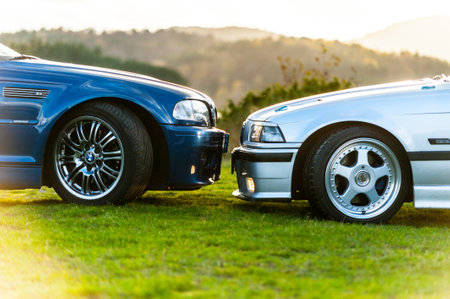 Lindesnes, Norway - October 15 2011: A Blue BMW E39 M3 headlight to headlight with a silver BMW E36 M3 sports car.のeditorial素材