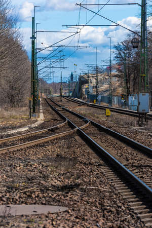 Train tracks through an industrial area.