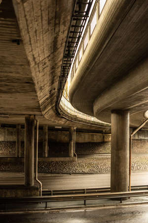 Two overpasses carrying traffic above a highway.