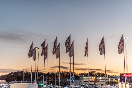 Gothenburg, Sweden - October 15 2020: ICA Maxi flags at a parking lot.のeditorial素材