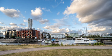 MalmÃ¶, Sweden - July 09 2022: High rise Turning Torso behind Apartment buildings at VÃ¤stra Hamnenのeditorial素材