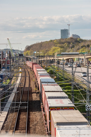 Gothenburg, Sweden - May 01 2022: Long container freight train moving southbound out of Gothenburgのeditorial素材
