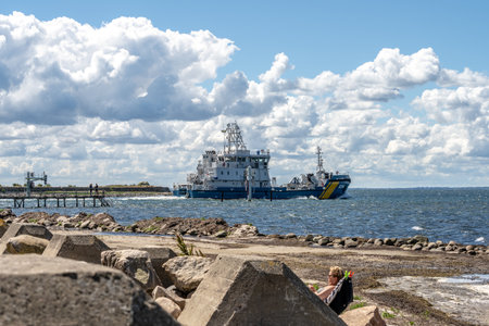 Landskrona, Sweden - July 10 2022: Swedish coast guard vessel 034 MalmÃ¶ leaving port of Landskronaのeditorial素材