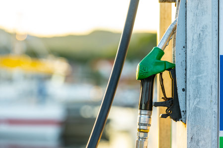Lindesnes, Norway - August 08 2022: Gasoline fuel handle docked at a pumpのeditorial素材