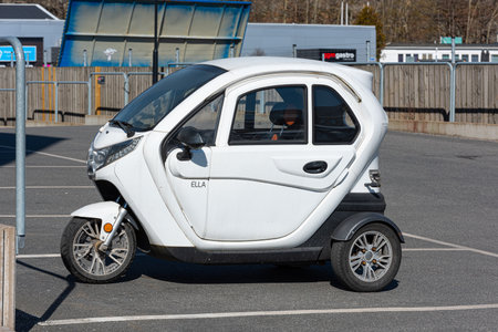 Gothenburg, Sweden - April 03 2022: Tiny white enclosed trike on a parking lotのeditorial素材