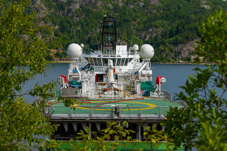 Lindesnes, Norway - August 09 2022: Top deck with cranes and antennae of seismic surveyor ship