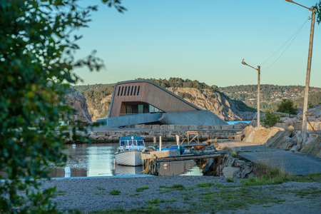 Lindesnes, Norway - August 08 2022: Evening light over underwater Micheling restaurant Under