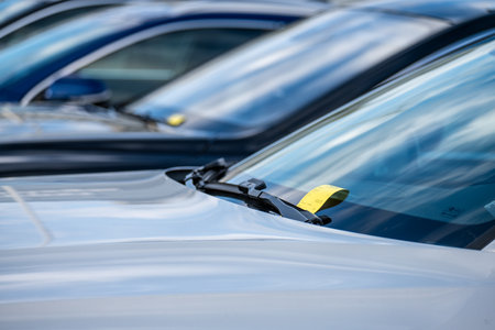 Gothenburg, Sweden - september 25 2022: Yellow parking ticket under the winscreen wiper of a carのeditorial素材