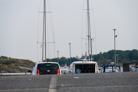 Gothenburg, Sweden - August 17 2022: Back of a white car resembling the back of a boat in a marina in front of itのeditorial素材