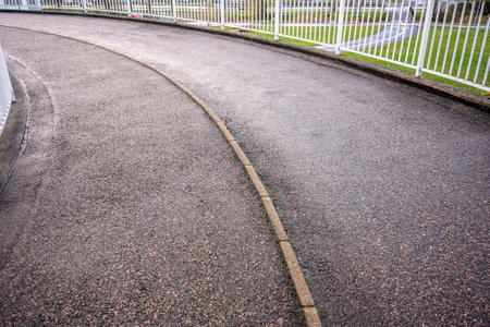 Spiral bicycle ramp over a highwayの写真素材