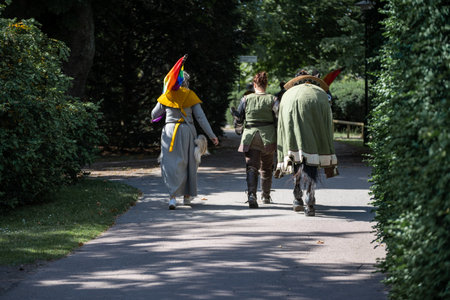 MalmÃ¶, Sweden - July 09 2022: Participant of a medieval gathering carrying rainbow flags