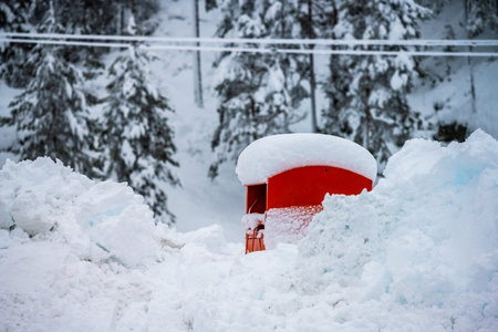 Recycling container deep in snow