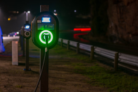 Lindesnes, Norway - January 06 2023: Row of MER electric car chargers at nightのeditorial素材