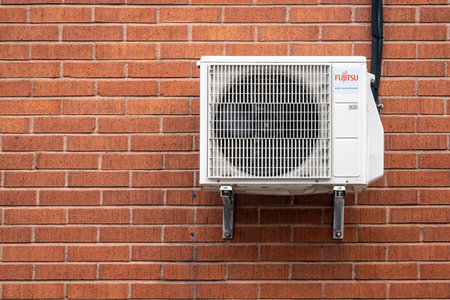 Gothenburg, Sweden - October 12 2022: Fujitsu air condition unit on the wall of a brick buildingのeditorial素材