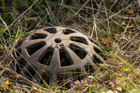 Gothenburg, Sweden - October 13 2022: Drain hole cover in grass
