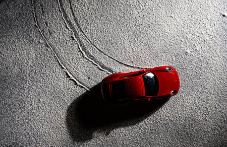 Gothenburg, Sweden - november 27 2022: Top view of a red Porsche 911 model car in snow.のeditorial素材