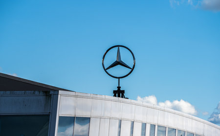 Gothenburg, Sweden - July 07 2022: Mercedes-Benz star logo rotating on top of a dealershipのeditorial素材