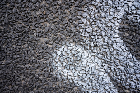 White graffiti tag on a stone gravel wallの写真素材