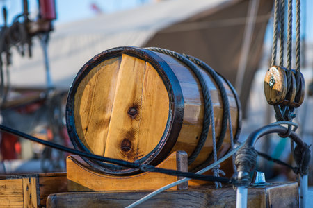 Small wooden barrel mounted on a boatの写真素材