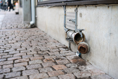 Disused pipe coupling formerly used to receive beer from tank truckの写真素材