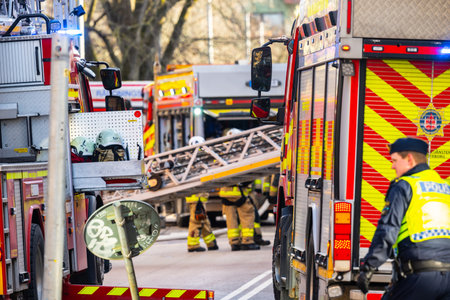 Gothenburg, Sweden - February 25 2023: Fire department crew and trucks in action during a fire.のeditorial素材