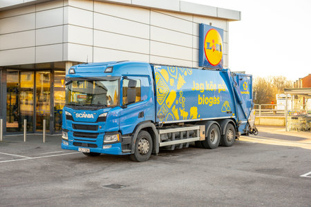 Gothenburg, Sweden - February 26 2023: Scanoa P340 garbage truck outside a Lidl shop.のeditorial素材