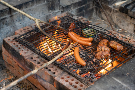 Tasty hot dogs on barbeque