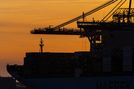 Large container vessel loading goods at port