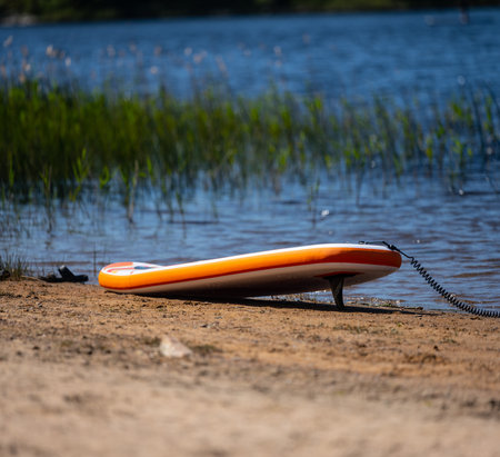 Stand up paddle board on a sand beachの写真素材