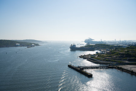 Gothenburg, Sweden - June 05 2023: Afternoon view of the inlet and industrial harbour of Gothenburg