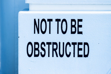 Not to be obstructed text on a hatch