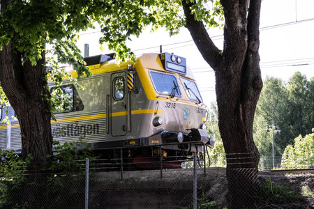BorÃ¥s, Sweden - May 28 2023: Commuter train VÃ¤sttÃ¥gen 3215 at BorÃ¥s station