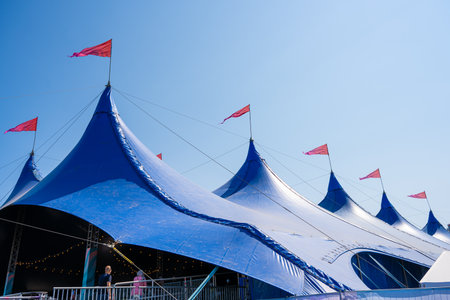 Gothenburg, Sweden - June 03 2023: Large blue tents with red flagsのeditorial素材