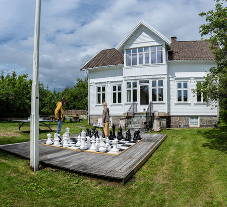 Lyngdal, Norway - July 06 2023: Two kids playing large garden chessのeditorial素材