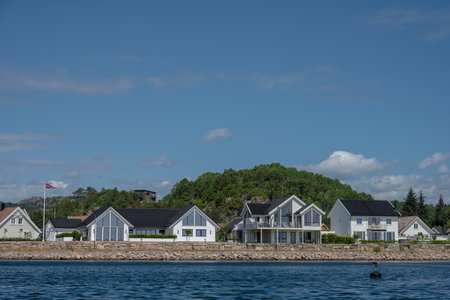Lindesnes, Norway - June 22 2023: Large white villas by a canalのeditorial素材